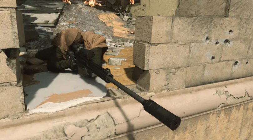 Warzone player aiming with sniper rifle in gap of a brick wall